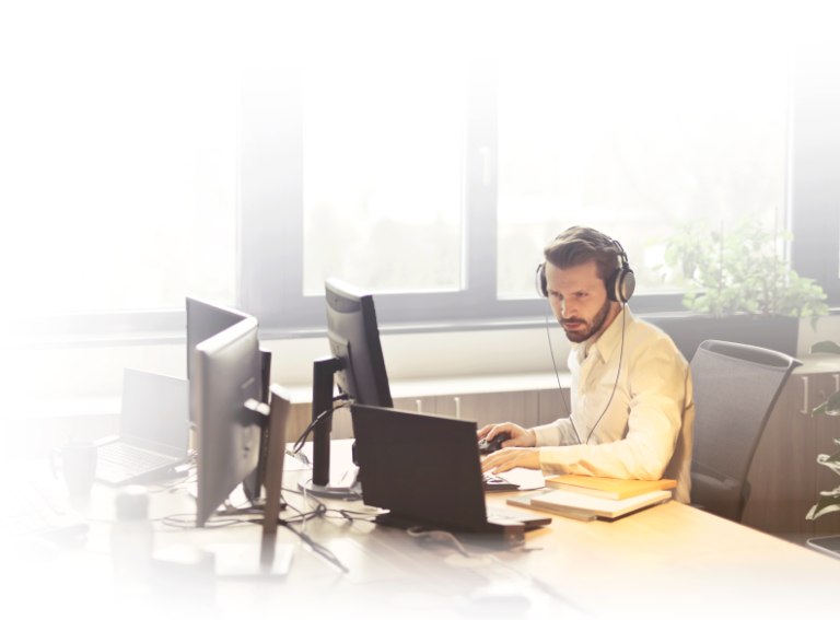 Man working in front of computers